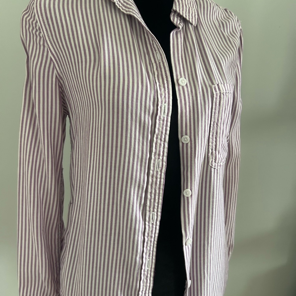 Woman’s purple and white striped button down shirt